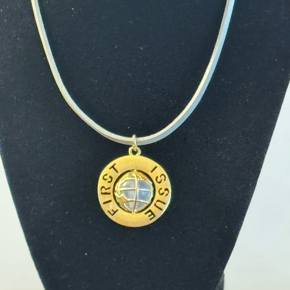 VTG G/T pendant featuring spinning globe w/text “First Issue” on outer ring - Picture 4 of 7